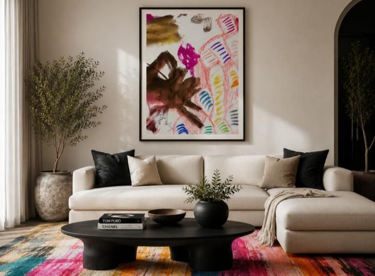 Colourful abstract artwork above a cream sofa with patterned rug